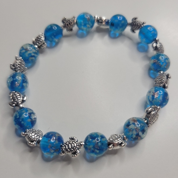 NWT Turtle Charms W Ocean Blue Glow In The Dark Firefly Glass Stretch Bracelet - Picture 13 of 14